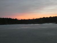 Sunset over a frozen main pond