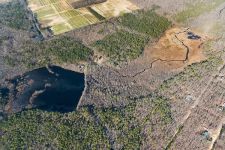 Aerial view of main pond and surrounding areas of the Refuge, courtesy Cliff Compton